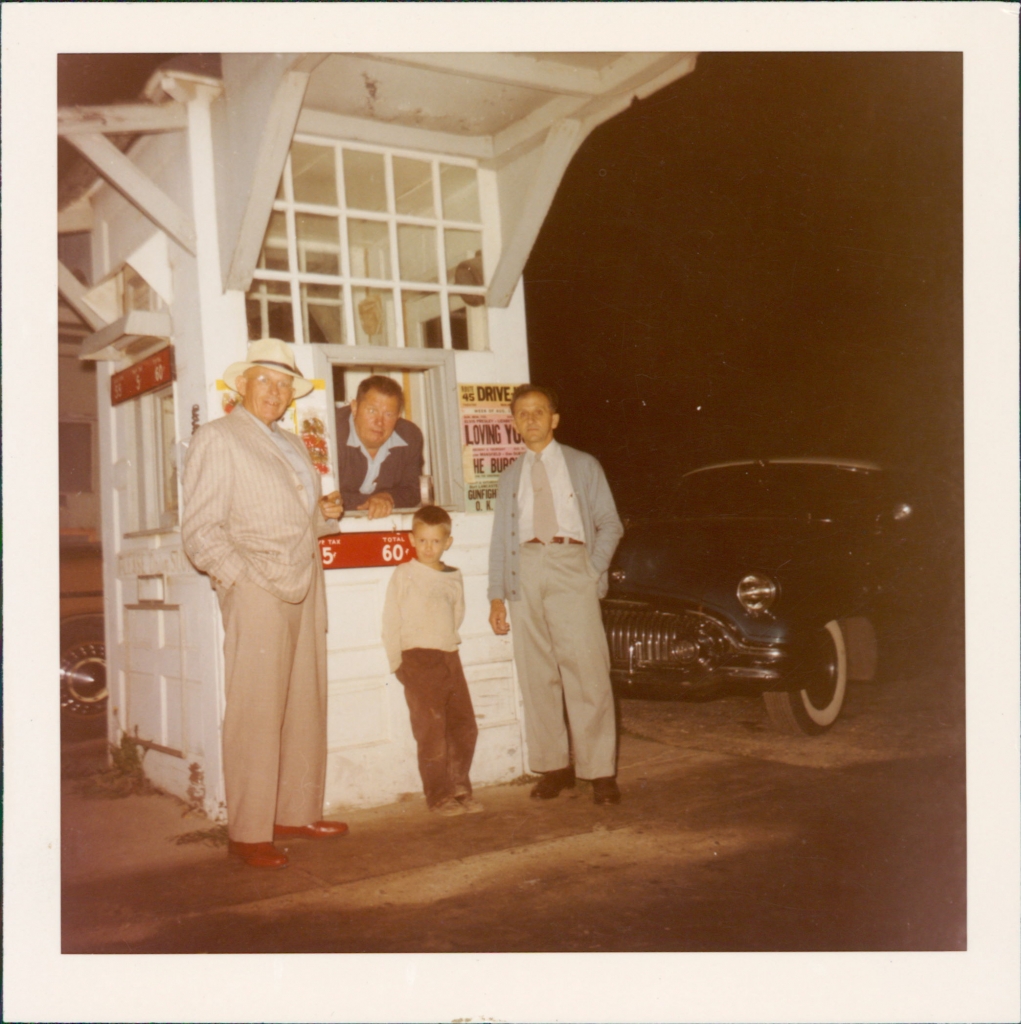 William Beck selling tickets.  The boy pictured in the center is William's son, Dennis.  