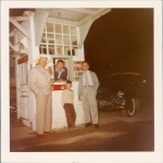 William Beck selling tickets.  The boy pictured in the center is William's son, Dennis.  